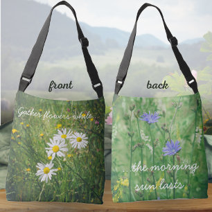 Chamomile and chicory flowers on the green meadow crossbody bag
