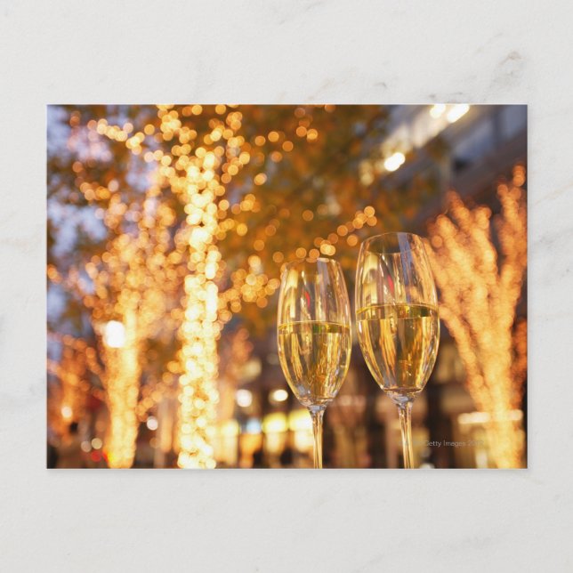 Champagne glasses toasting Christmas on city Holiday Postcard (Front)