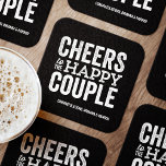 Cheers to the happy couple black rehearsal dinner square paper coaster<br><div class="desc">Before your wedding day, have some fun with a "Brews Before I Do's" celebration. Whether it's a rehearsal dinner, bachelor party or engagement party, this fun bold coaster design is perfect for a brewery or beer-themed celebration. This "cheers to the happy couple" original design can also be personalised with the...</div>
