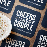 Cheers to the happy couple navy rehearsal dinner square paper coaster<br><div class="desc">Before your wedding day, have some fun with a "Brews Before I Do's" celebration. Whether it's a rehearsal dinner, bachelor party or engagement party, this fun bold coaster design is perfect for a brewery or beer-themed celebration. This "cheers to the happy couple" original design can also be personalised with the...</div>