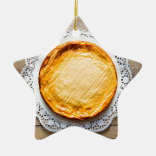 Cheesecake on rustic wood cake top. ceramic tree decoration