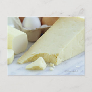 Cheeses and eggs. Eggs are rich in protein and Postcard