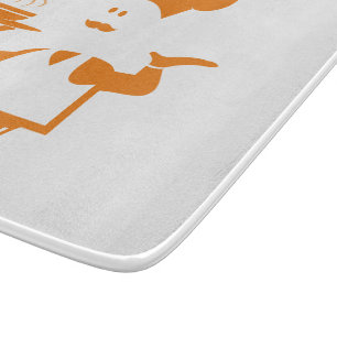 Chef holding a bowl of soup cutting board