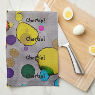 Cherish a playful and colourful time! tea towel