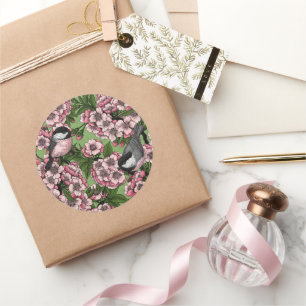 Cherry blossom and chickadees on green classic round sticker