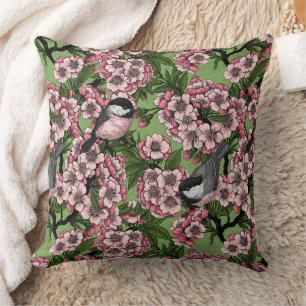 Cherry blossom and chickadees on green cushion
