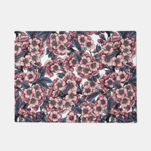 Cherry blossom in pink and blue doormat