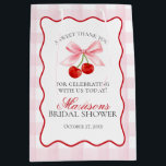 Cherry Sweet Pink Coquette Bow Bridal Shower Favou Medium Gift Bag<br><div class="desc">Someone cherry sweet is tying the knot and you’re the cherry on top of their sweet celebration. Add a nostalgic touch to your bridal shower with this Pink Gingham Cherry Party Decor featuring vibrant red cherries and pastel pink gingham, all within a whimsical wavy border. With this playful design, get...</div>