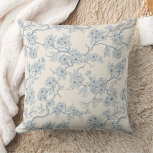 Chery blossom branches in blue and off white cushion