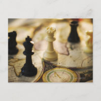 Chess pieces on old world map