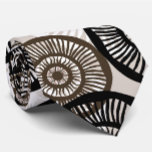 Chic Abstract Circle Wheel Neutral  Tie<br><div class="desc">This necktie has a contemporary white,  brown,  and black circular circle pattern on a soft tan beige background. Chic,  elegant and stylish in neutral colours.  An abstract digital motif in a reto style. Inspired by the wheels on a bus that go round and round. Cool tie.</div>