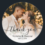 Chic Black White Script Wedding Photo Thank You Classic Round Sticker<br><div class="desc">Modern Pretty Black and White Calligraphy Script Thank You | Couple Photo Wedding sticker/label for yor gift favour. Featuring an elegant handwritten style calligraphy overlay with text „Thank You”.</div>