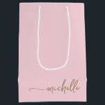 Chic Gold Monogram Name Script Blush Pink Medium Gift Bag<br><div class="desc">Elegant Modern Blush Pink Delicate Glam Gold Monogram Name Script Signature Custom Personalised Gift Bag. This design featuring your first name in a pretty hand lettered style swash tail font signature typography (or calligraphy) in gold on light blush pink or baby pink colour background. These are easy to customise it....</div>