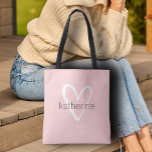Chic Heart Personalised Blush Pink  Tote Bag<br><div class="desc">This blush pink tote bag is personalised with your name in a simple font over a large white heart. Ideal for yourself,  for your bridesmaids,  book club,  graduation gift,  birthday gift,  teacher's gift or any occasion. MORE colours in our store.</div>