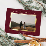 Chic Minimalist Elegance Burgundy Christmas Photo<br><div class="desc">This elegant holiday photo card features one horizontal photo, classic raised foil frame around the photo, and a greeting in raised foil over a burgundy red background. The greeting on the front is editable so it's easily changed to anything you like. The back of the card is the same burgundy...</div>