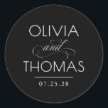 Chic Modern Minimalist Typography Black Wedding Classic Round Sticker<br><div class="desc">Minimalist black wedding seals place the couple’s names front and centre — boldly presented and elegantly connected by a calligraphic “and” that adds a graceful,  romantic flourish.

Fully customisable to reflect your unique style — with adjustable text and background colours to perfectly complement your wedding aesthetic.</div>