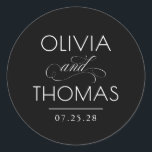 Chic Modern Minimalist Typography Black Wedding Classic Round Sticker<br><div class="desc">Minimalist black wedding seals place the couple’s names front and centre — boldly presented and elegantly connected by a calligraphic “and” that adds a graceful,  romantic flourish.

Fully customisable to reflect your unique style — with adjustable text and background colours to perfectly complement your wedding aesthetic.</div>
