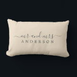 Chic Newlywed Mr Mrs Ivory Monogram Lumbar Cushion<br><div class="desc">Chic, modern monogrammed ivory pillow with the text Mr and Mrs in off-black elegant script on an ivory background. The colour magnolia blossom is used for this stylish design. Simply add your married name. Perfect luxury wedding gift for the newlywed couple. Exclusively designed for you by Happy Dolphin Studio. If...</div>