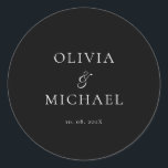 Chic Script Black Minimalist Wedding Classic Round Sticker<br><div class="desc">Add a personal and elegant touch to your wedding favors, envelopes, or packaging with this minimalist round sticker featuring your custom name in a graceful script font. Designed to complement a modern and timeless wedding theme, this classic black-and-white design pairs beautifully with any part of your celebration. Perfect for sealing...</div>