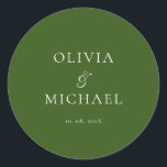 Chic Script Forest Green Minimalist Wedding Classic Round Sticker<br><div class="desc">Add a personal and elegant touch to your wedding favors, envelopes, or packaging with this minimalist round sticker featuring your custom name in a graceful script font. Designed to complement a modern and timeless wedding theme, this classic forest green and white design pairs beautifully with any part of your celebration....</div>