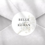Chic White & Beige Botancial Wedding Classic Round Sticker<br><div class="desc">An elegant round wedding envelope seal sticker featuring soft botanical artwork and timeless typography. The design highlights the couple’s names and wedding date over delicate neutral greenery,  creating a romantic and refined finishing touch for invitations,  envelopes,  and wedding stationery. Perfect for modern,  minimalist,  or botanical wedding themes.</div>