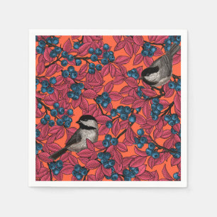 Chickadee birds on blueberry branches on orange napkin