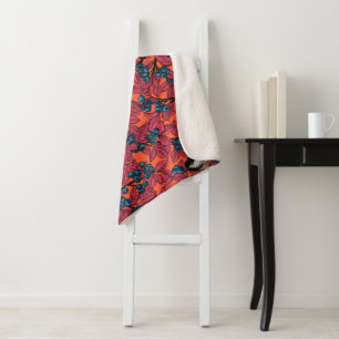 Chickadee birds on blueberry branches on orange sherpa blanket