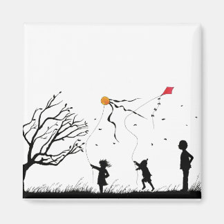 Children flying kites magnet