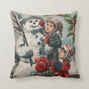 Children Making Snowman Holly Cushion