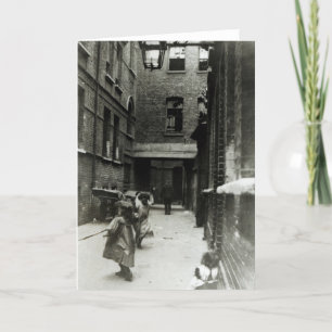 Children playing in a slum, 1899 card