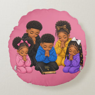 Children praying round cushion