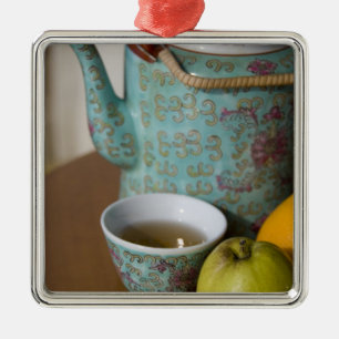 China, Hong Kong. Traditional Chinese teapot & Metal Tree Decoration