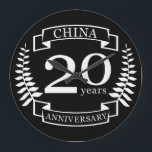 China Traditional wedding anniversary 20 years Large Clock<br><div class="desc">A design to celebrate 20 years of marriage. This design has a white (china) coloured laurel design on a black background. China is the traditional gift for this occasion. The text reads china 20 years anniversary. A romantic design to celebrate your 20th year of marriage. If you would like any...</div>