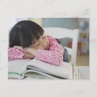 Chinese girl napping on textbooks postcard