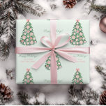 Chinoiserie Pink Green Merry Christmas Family Name Wrapping Paper<br><div class="desc">Watercolor Christmas Tree ornately decorated in pink and white (Chinoiserie ornaments,  poinsettia flowers,  pink bows). These elements were handpainted by yours truly before being arranged into a repeating pattern with the ability to add personalised text.</div>