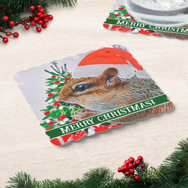 Chipmunk with Christmas Hat in Front of Tree Paper Coaster (This paper coaster features a Christmas tree, chipmunk with Santa hat, and your custom text.)