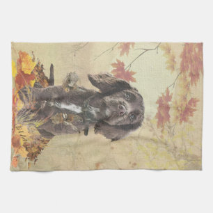 Chocolate cocker spaniel puppy tea towel