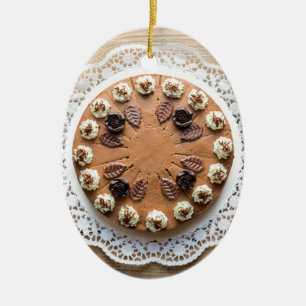 Chocolate cream pie on rustic wood cake top ceramic tree decoration