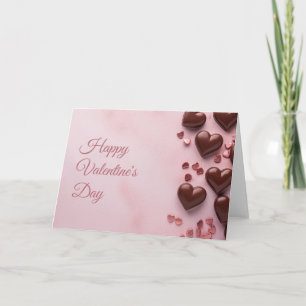 Chocolate hearts on pink ground Valentine's Card