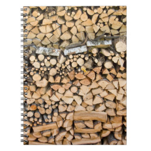 Chopped wood on a pile notebook