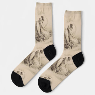 Christian angel sitting on a stone socks
