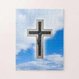 Christian cross at blue sky background jigsaw puzzle