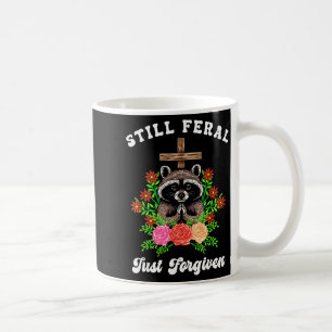 Christian Raccoon Cross Still Feral Just Forgiven Coffee Mug
