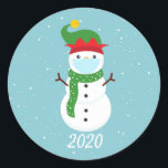 Christmas 2020 Face Mask Snowman Quarantine Classic Round Sticker<br><div class="desc">This design was created though digital art.  It may be personalised 

Contact me at colorflowcreations@gmail.com if you with to have this design on another product.  

Purchase my original abstract acrylic painting for sale at www.etsy.com/shop/colorflowart.   See more of my creations or follow me at www.facebook.com/colorflowcreations,  www.instagram.com/colorflowcreations,  www.twitter.com/colorflowart,  and www.pinterest.com/colorflowcreations.</div>