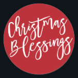 Christmas Blessings, Modern Handwritten Typography Classic Round Sticker<br><div class="desc">Christmas Blessings is written in a bold white very trendy and modern script. It really shows up on a deep holiday red background. Attach this Christmas sticker anywhere you want to emphasize the true meaning of Christmas. Use it to seal your Christmas card envelopes or to add a special touch...</div>