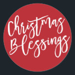 Christmas Blessings, Modern Handwritten Typography Classic Round Sticker<br><div class="desc">Christmas Blessings is written in a bold white very trendy and modern script. It really shows up on a deep holiday red background. Attach this Christmas sticker anywhere you want to emphasize the true meaning of Christmas. Use it to seal your Christmas card envelopes or to add a special touch...</div>