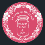 Christmas Blessings Peace Love Joy Mason Jar Classic Round Sticker<br><div class="desc">Rustic country Christmas Blessings sticker features a mason jar labelled with Peace, Love and joy. Christmas Blessings is curved around the top of the mason jar. The entire design is framed with a modern holly wreath. All of the text and graphics are white. They look wonderful against a bright rosy...</div>