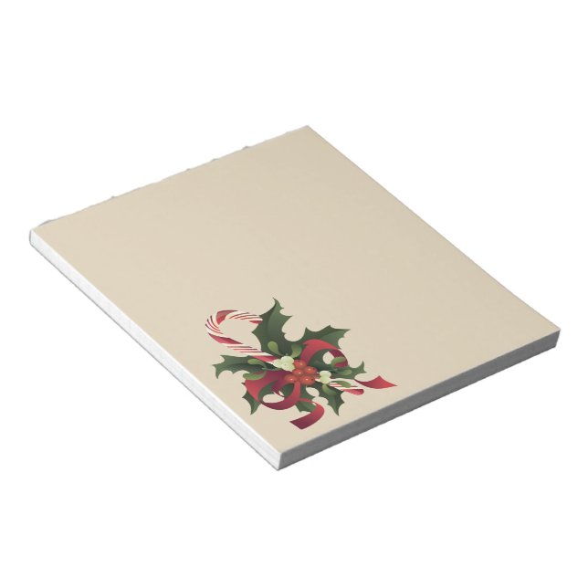 Christmas candy cane in a mistletoe and holly berr notepad (Angled)