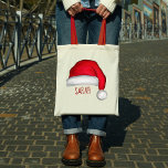 Christmas Cute Red Santa Claus Custom Tote Bag<br><div class="desc">This design features a Christmas tote bag,  with a cute,  Santa Claus,  red,  jolly,  funny,  style custom,  personalised,  with whimsical,  fun lettering.</div>