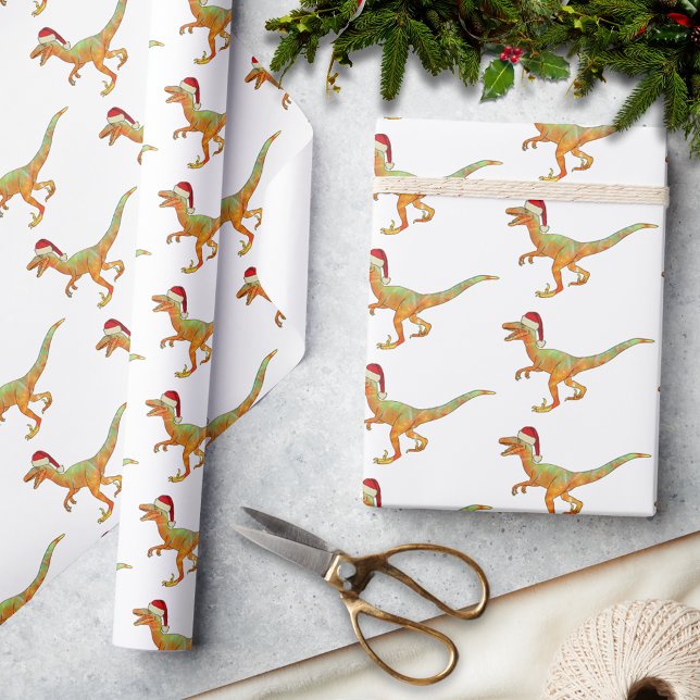 Christmas Dinosaur Raptor Wrapping Paper (Christmas dinosaur velociraptor wearing a santa hat pattern holiday wrapping paper festive raptor )